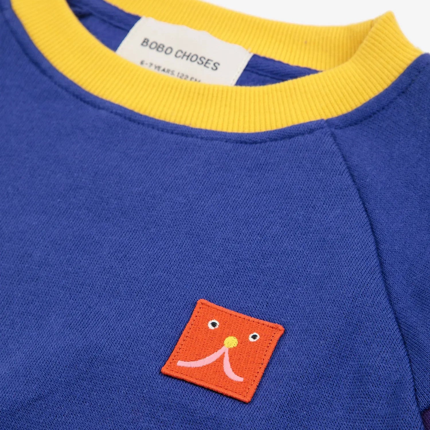 Funny Face patch ranglan sleeve sweatshirt