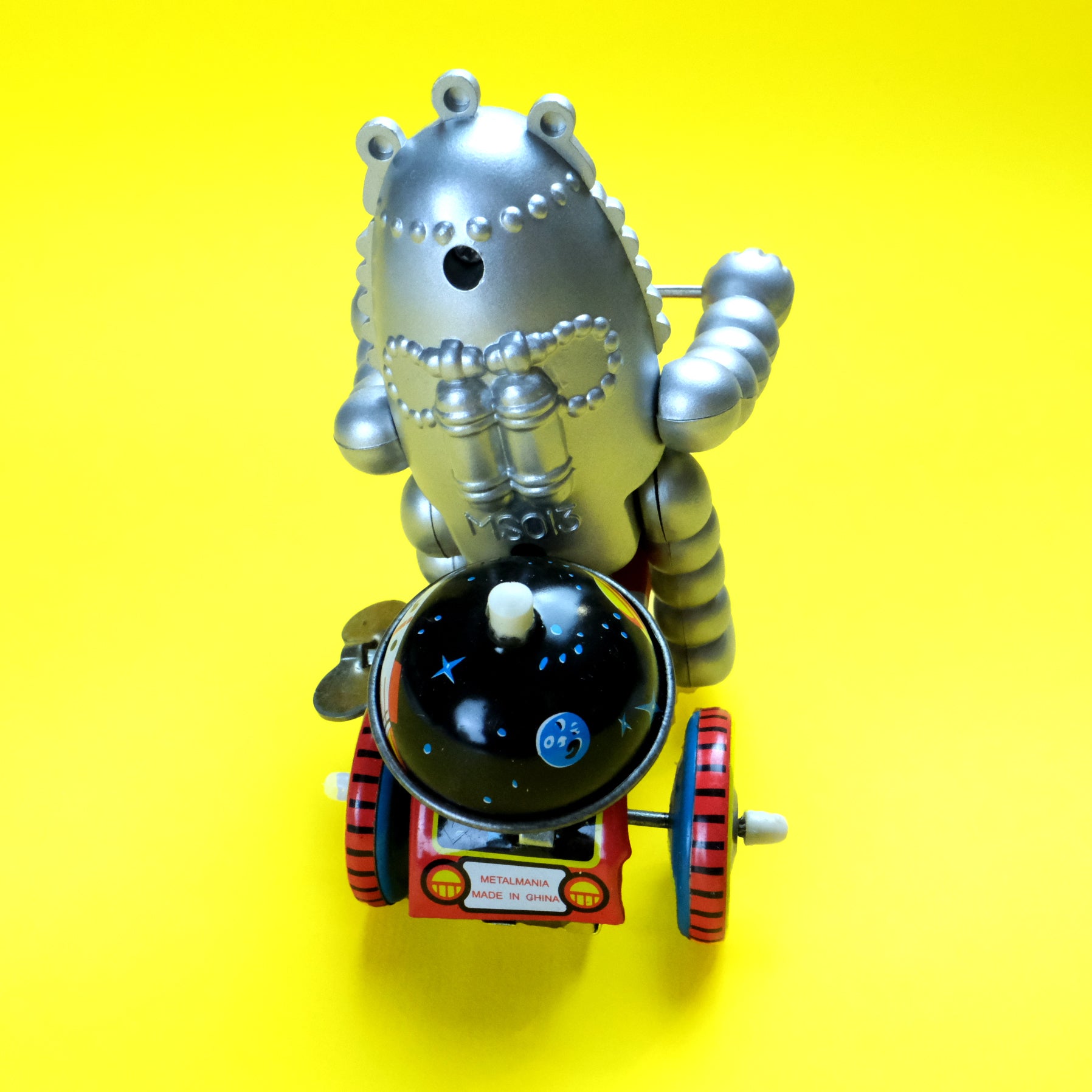 Robot baby on tricycle