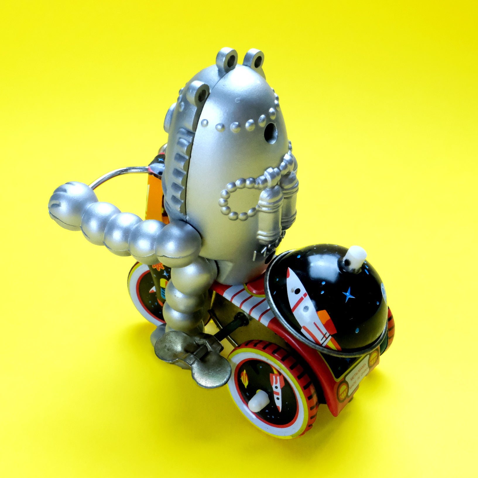 Robot baby on tricycle