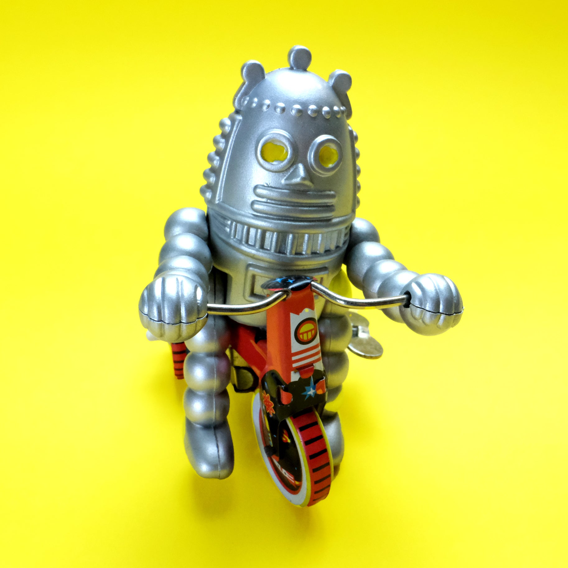 Robot baby on tricycle