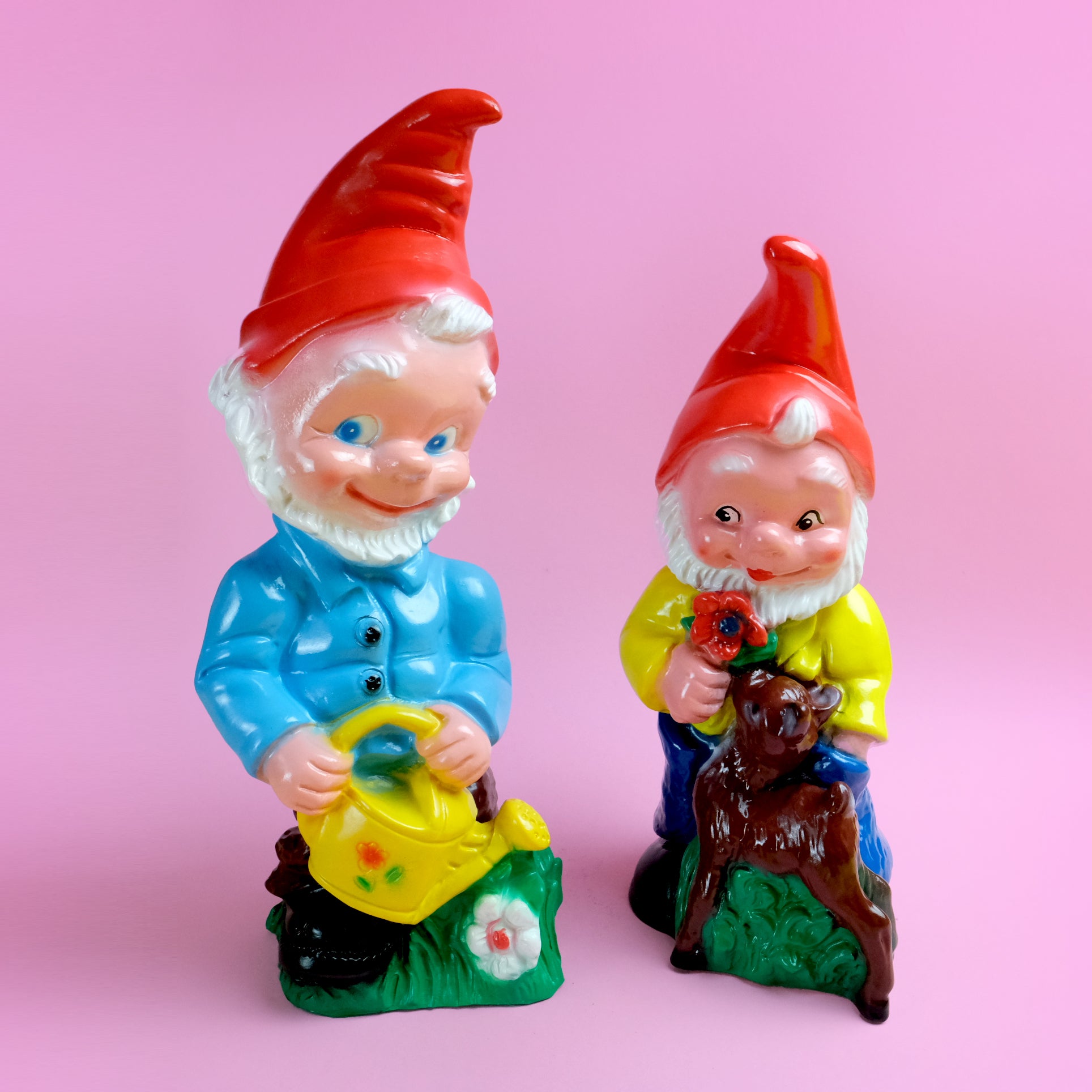 Garden gnome with yellow watering pot
