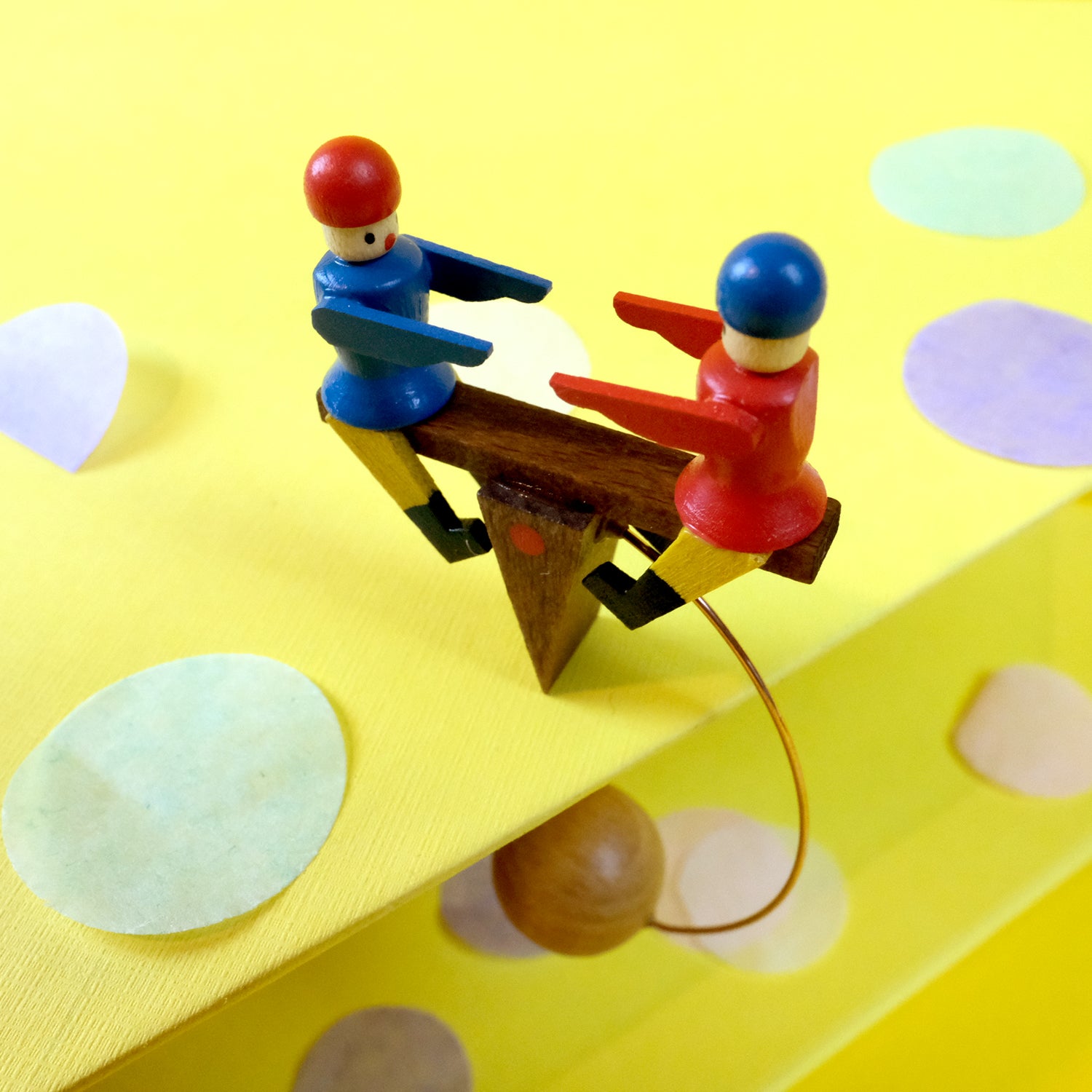 Rocking children on seesaw