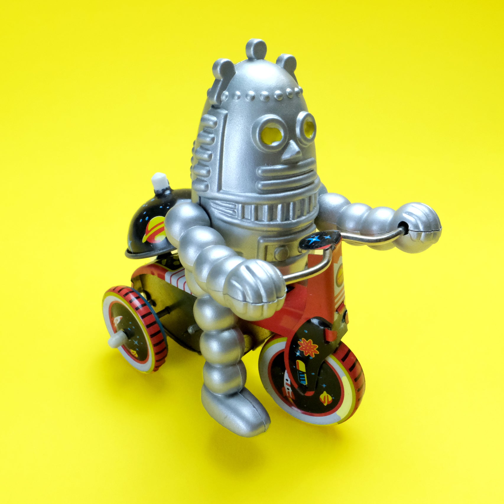 Robot baby on tricycle