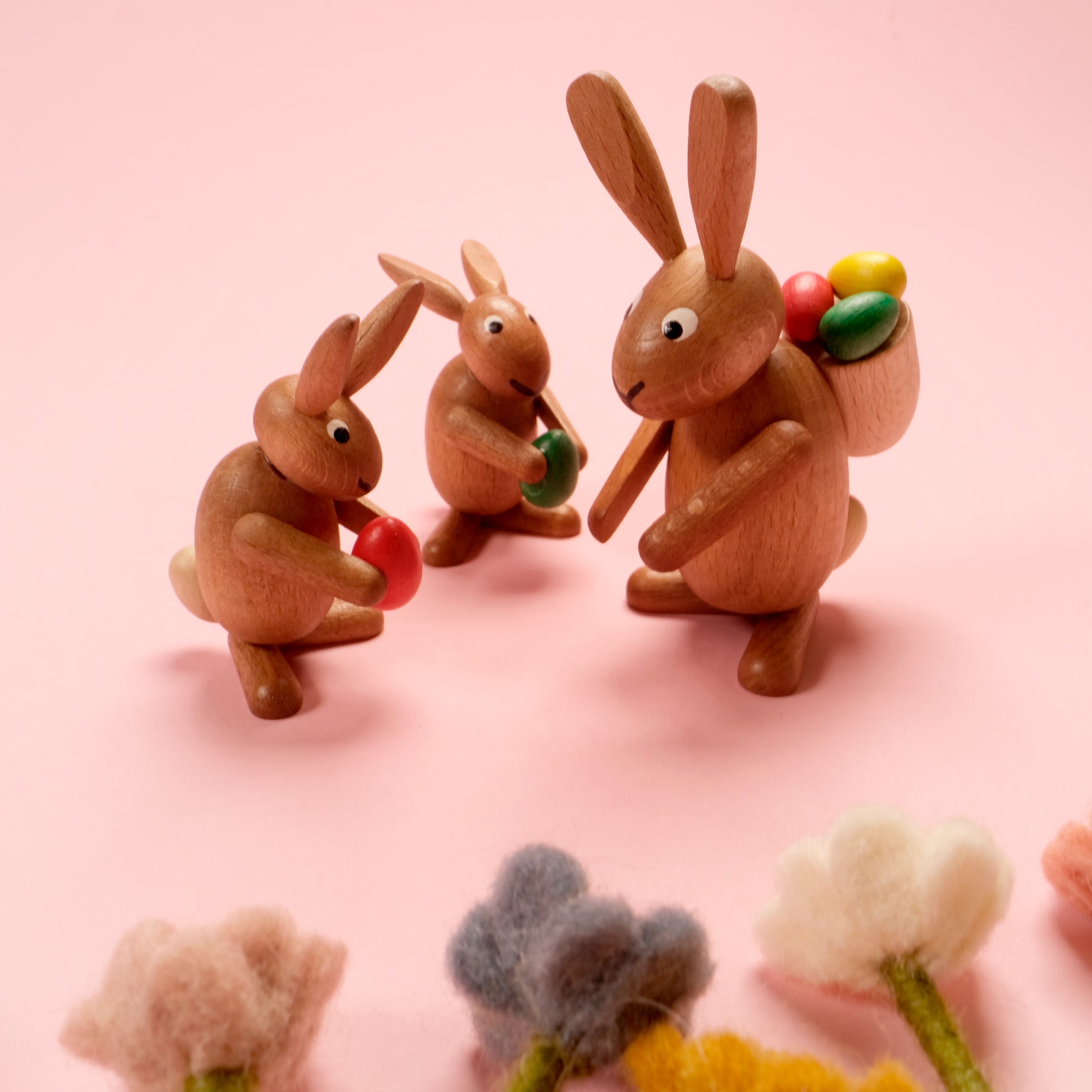 Wooden rabbits trio