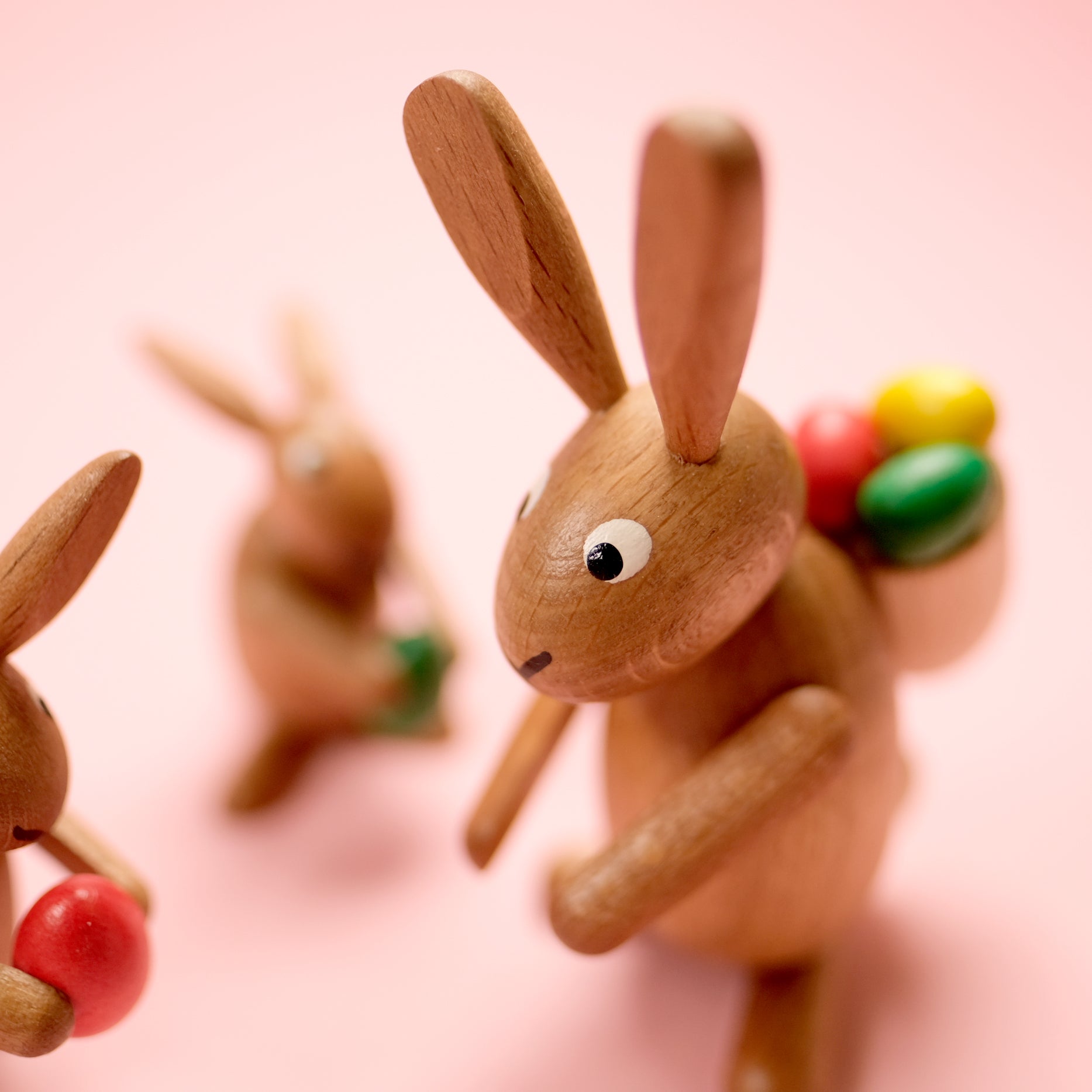 Wooden rabbits trio
